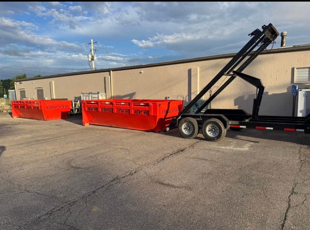 Two BS Disposals dumpsters staged in a parking lot