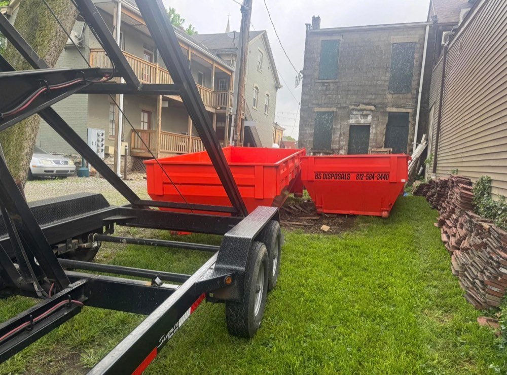 Dumpster placed behind a downtown building for a demo cleanout