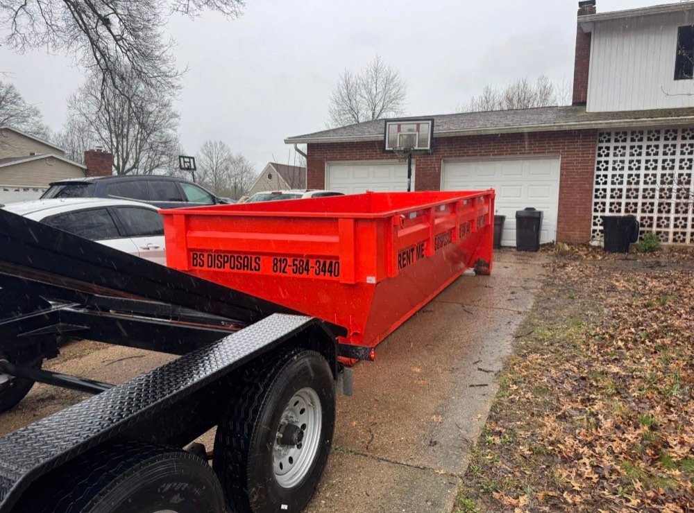 Dumpster placed in a residential driveway